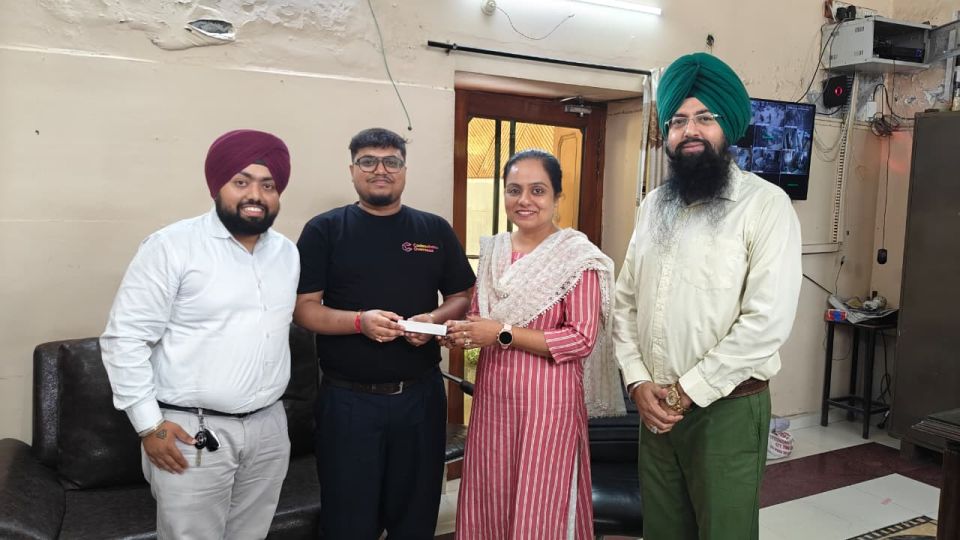 Codescholar Overseas team handing over a student offer letter